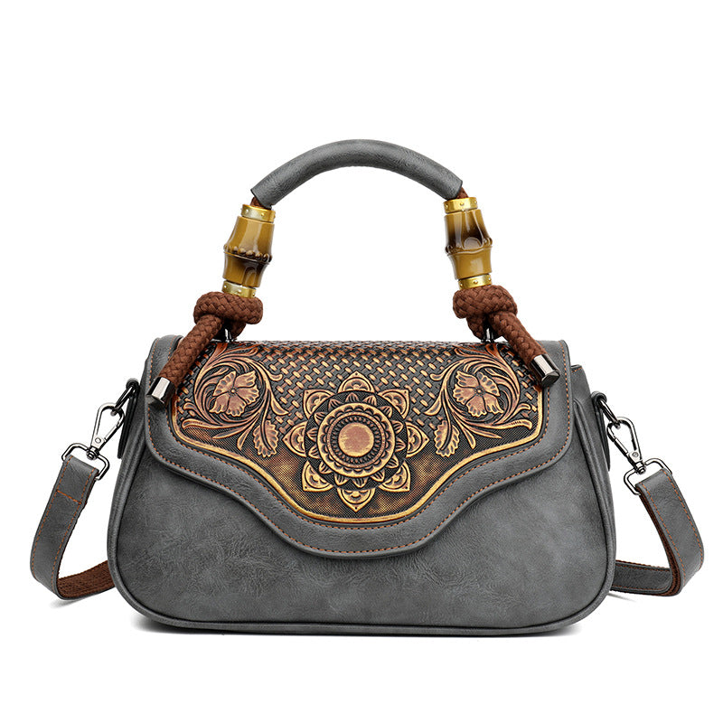 Handcrafted Leather Crossbody Bag with Embossed Retro Design