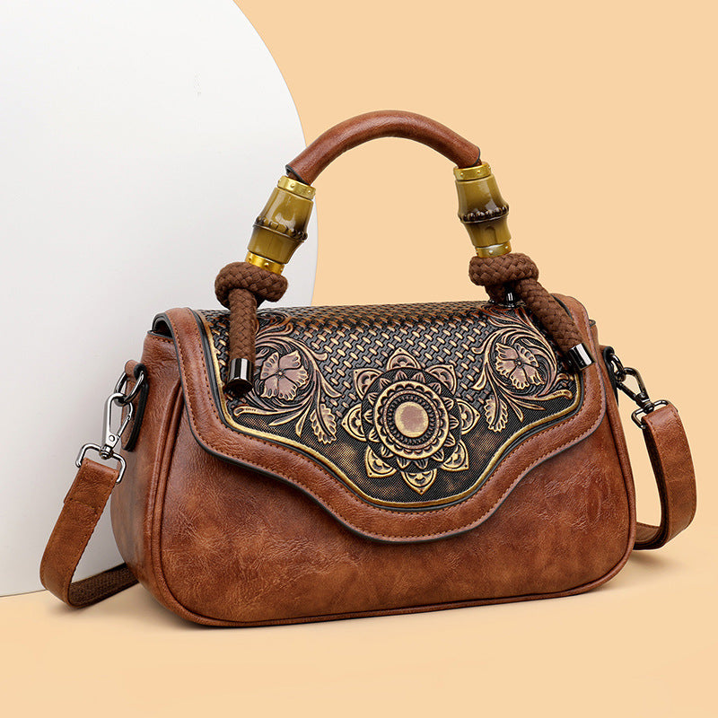 Handcrafted Leather Crossbody Bag with Embossed Retro Design